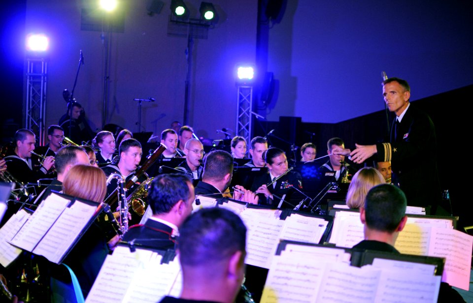 US Navy 101119-N-6138K-092 Members of the U.S. Naval Forces Europe Band, led by Lt. Cmdr. Ken Collins, perform for more than 420 military and civi