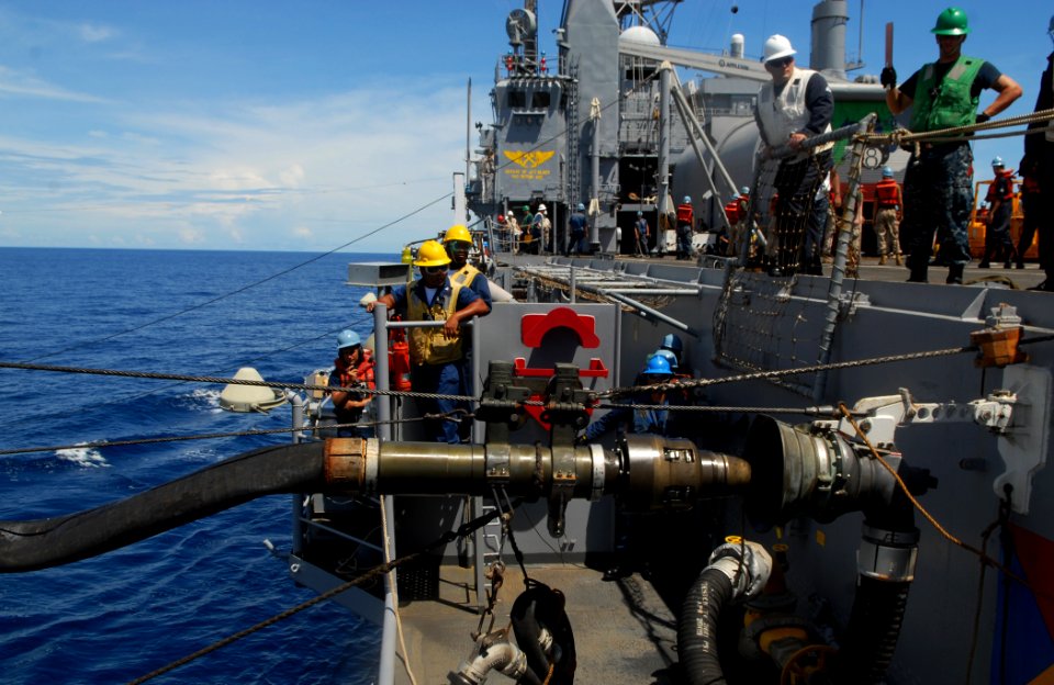 US Navy 101117-N-9706M-088 Deck department Sailors aboard the amphibious transport dock ship USS Dubuque (LPD 8) watch as the fuel probe from the M