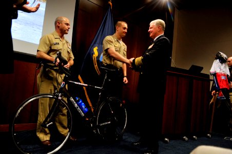 US Navy 101121-N-8273J-044 Chief of Naval Operations (CNO) Adm. Gary Roughead, right, and Capt. Key Watkins, left, commanding officer of Safe Harbo