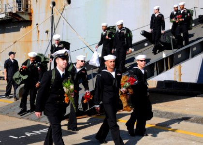 US Navy 101118-N-6125G-096 New fathers depart the amphibious assault ship USS Iwo Jima (LHD 7) at Naval Station Norfolk after a four-month Continui