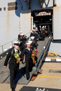 US Navy 101118-N-6764G-069 Sailors depart the amphibious assault ship USS Iwo Jima (LHD 7) at Naval Station Norfolk after a four-month Continuing