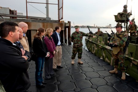US Navy 101118-N-9095H-034 National War College students and faculty listen as Capt. Christopher Halton, commanding officer of Riverine Group 1, de