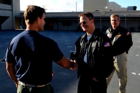 US Navy 101122-N-7883G-047 Capt. William Wilson, commanding officer of the Naval Special Warfare Center, speaks with actor Gary Sinise during his photo