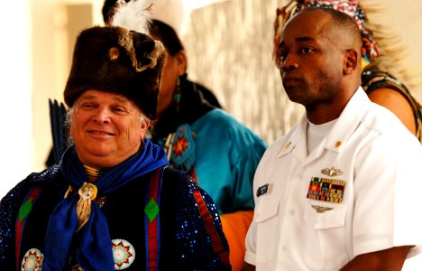 US Navy 101118-N-7498L-030 Native American Dr. David Windhorse Long stands with Senior Chief Electrician's Mate Sidney Coverson, assigned to Comma