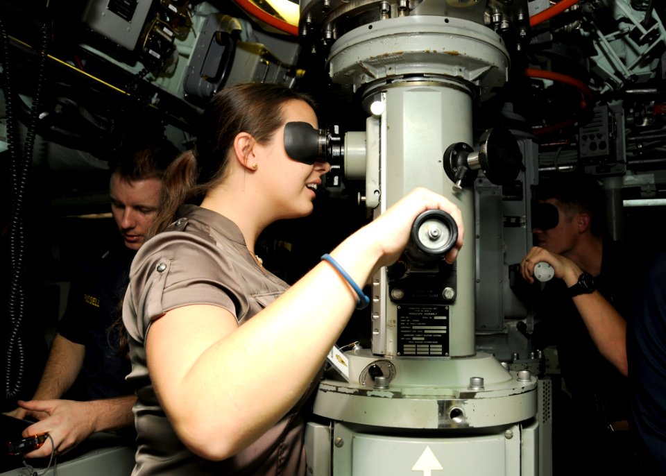 US Navy 101119-N-3560G-001 The spouse of Lt. j.g. John Russell looks through the periscope aboard the attack submarine USS Cheyenne (SSN 773) durin