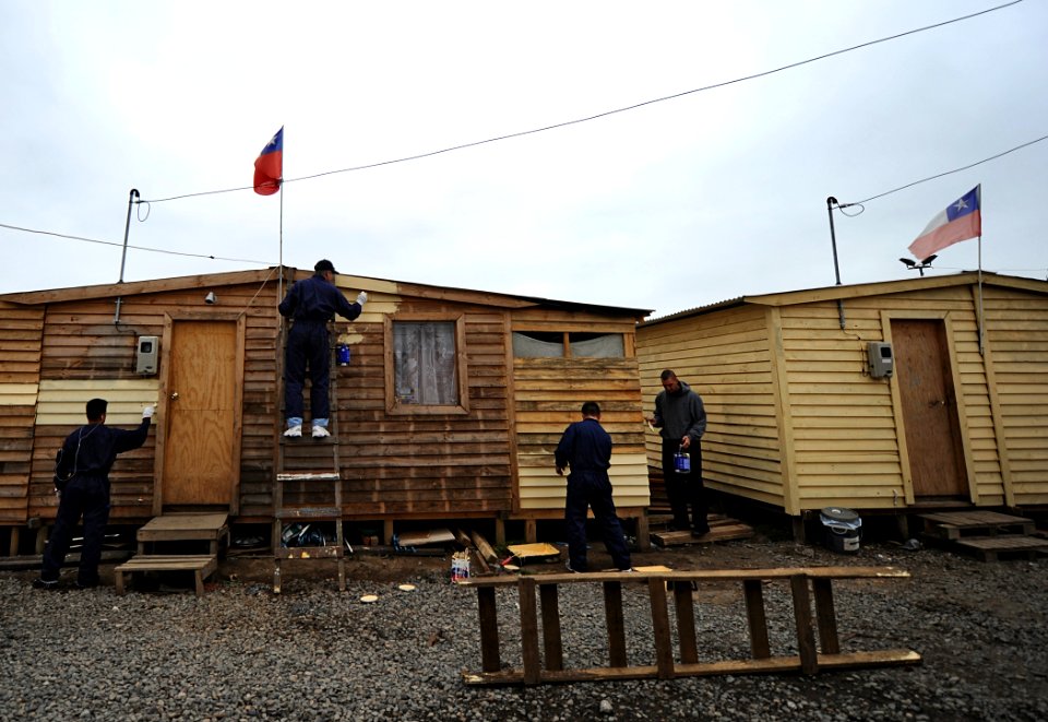 US Navy 101124-N-2984R-034 Service Members assigned to High Speed Vessel (HSV 2) Swift help paint houses during a community services project suppor