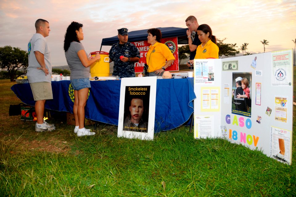 US Navy 101118-N-3560G-001 Tracy Navarrete, center, the Health Promotions Officer at Naval Health Clinic, Hawaii, educates service members on the d