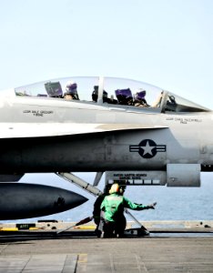 US Navy 101119-N-6003P-003 Pilots assigned to the Swordsmen of Strike Fighter Squadron (VFA) 32 await the signal to launch aboard the aircraft carr
