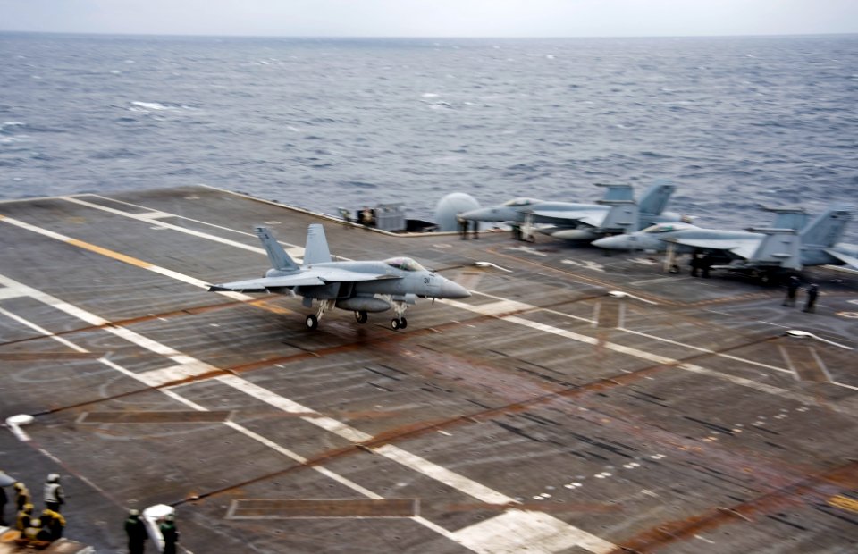 US Navy 101124-N-9626Y-084 An F-A-18E Super Hornet assigned to the Eagles of Strike Fighter Squadron (VFA) 115 lands aboard the aircraft carrier US