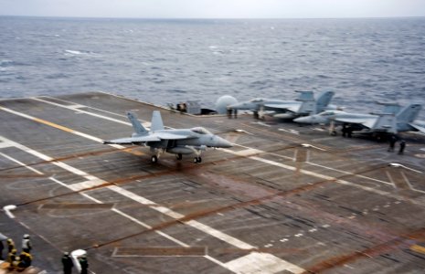 US Navy 101124-N-9626Y-084 An F-A-18E Super Hornet assigned to the Eagles of Strike Fighter Squadron (VFA) 115 lands aboard the aircraft carrier US