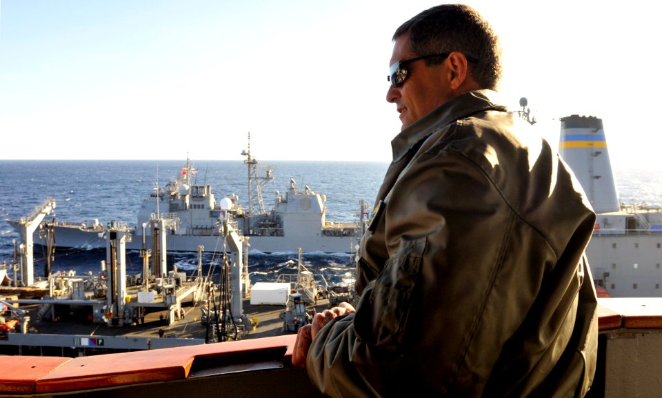 US Navy 101127-N-7103C-105 USS George Washington (CVN 73)Commanding Officer, Capt. David Lausman watches the Military Sealift Command's Fleet Reple