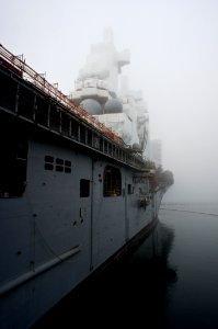 US Navy 101118-N-9643K-808 A view of the amphibious assault ship USS Bonhomme Richard (LHD 6) in early morning fog at Naval Station San Diego