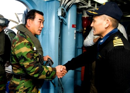 US Navy 101128-N-9626Y-006 Capt. Reid Tanaka Chief of Staff of Commander Task Force (CTF) 70 greets Republic of Korea's (ROK) Rear Adm. Lee
