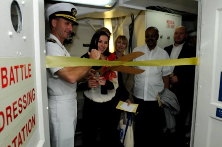 US Navy 101119-N-5812W-008 Cmdr. Robert Chadwick, commander officer of the guided-missile destroyer USS Roosevelt (DDG 80), and Asia Sides, the wi