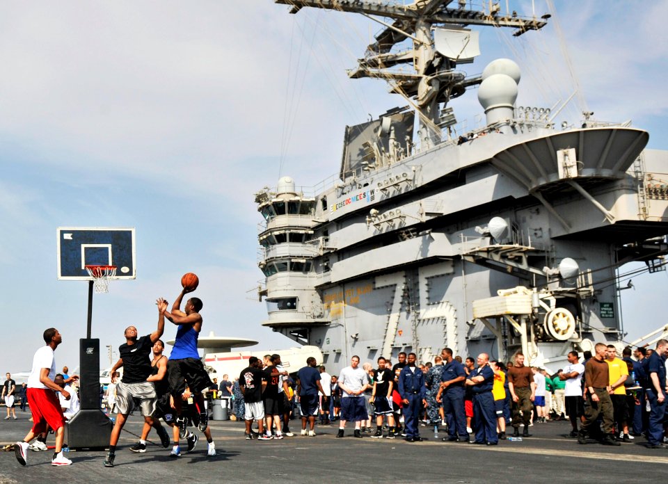 US Navy 101129-N-6003P-443 Sailors and Marines compete in a 3-on-3 basketball tournament on the flight deck of the aircraft carrier USS Harry S. Tr