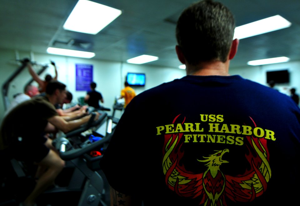 US Navy 101122-N-7948R-015 Cryptologic Technician (Technical) 1st Class Jared Pollack, right, observes as Sailors participate in an Inferno Triathl