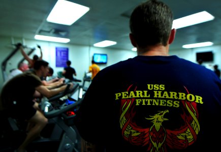 US Navy 101122-N-7948R-015 Cryptologic Technician (Technical) 1st Class Jared Pollack, right, observes as Sailors participate in an Inferno Triathl photo