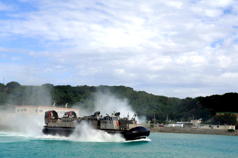 US Navy 101122-N-8335D-319 Landing Craft Air Cushion (LCAC) 21 assigned to Assault Craft Unit (ACU) 5 returns to the amphibious dock landing ship U