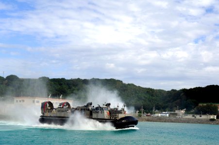 US Navy 101122-N-8335D-319 Landing Craft Air Cushion (LCAC) 21 assigned to Assault Craft Unit (ACU) 5 returns to the amphibious dock landing ship U