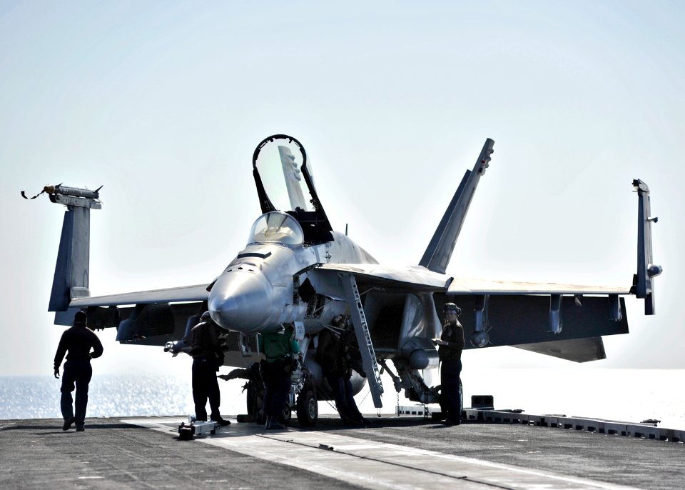 US Navy 101122-N-6003P-011 Sailors ready an F-A-18E Super Hornet for afternoon flight operations aboard the aircraft carrier USS Harry S. Truman (C