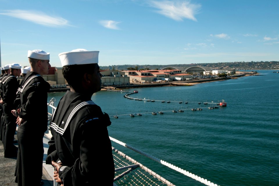 US Navy 101130-N-9123L-086 Sailors man the rails as the aircraft carrier USS Carl Vinson (CVN 70) departs for a three-week composite training unit