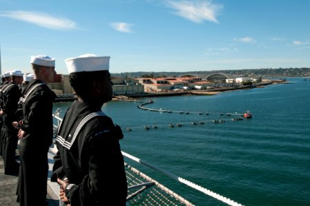 US Navy 101130-N-9123L-086 Sailors man the rails as the aircraft carrier USS Carl Vinson (CVN 70) departs for a three-week composite training unit