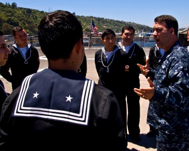 US Navy 101122-N-6724S-082 Hospital Corpsman 2nd Class Pablo Mercado guides Chilean navy medical corps personnel on a tour of High Speed Vessel Swi