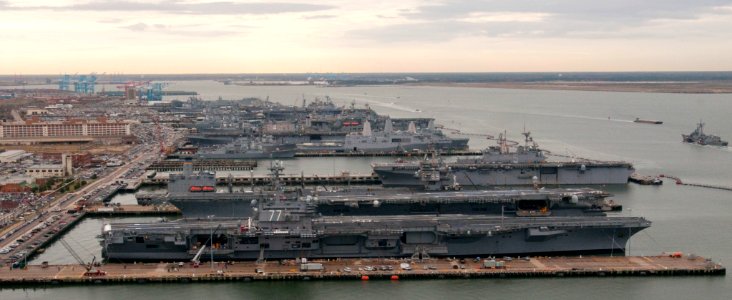 US Navy 101130-N-9589S-044 USS George H. W. Bush (CVN 77), front and USS Enterprise (CVN 65) are docked at Naval Station Norfolk photo