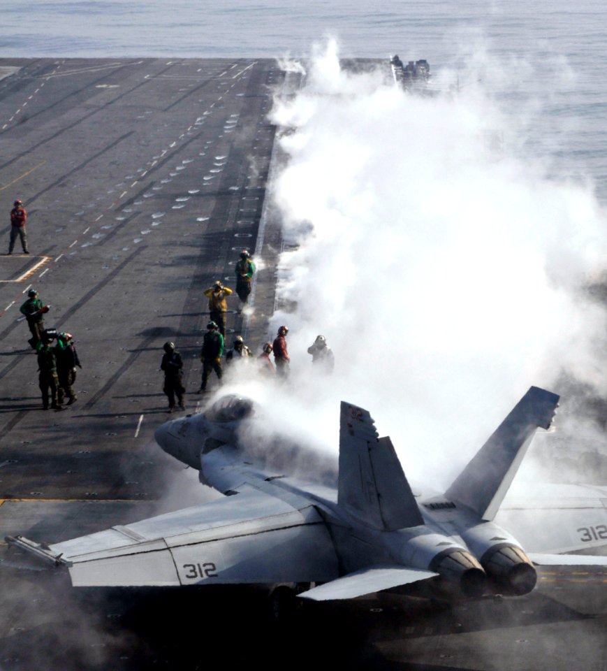 US Navy 101201-N-7103C-157 An F-A-18E Super Hornet assigned to the Eagles of Strike Fighter Squadron (VFA) 115 is positioned onto a catapult aboard