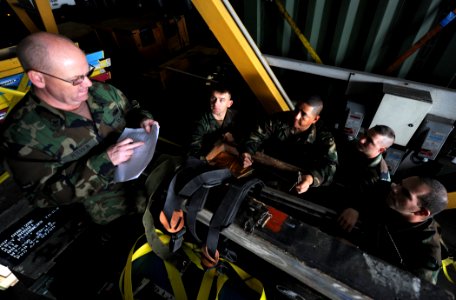 US Navy 101201-N-2984R-064 Sailors assigned to Naval Mobile Construction Battalion (NMCB) 28, inventory tool kits in the mission bay aboard High Sp photo