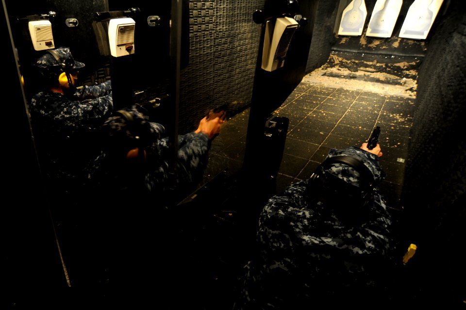 US Navy 101123-N-8335D-162 Sailors assigned to the amphibious dock landing ship USS Tortuga (LSD 46)) qualify with the 9mm Berretta pistol at a mob