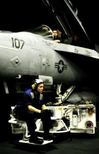 US Navy 101128-N-6003P-232 Sailors prepare to tow an F-A-18E Super Hornet in the hangar bay of the aircraft carrier USS Harry S. Truman (CVN 75)