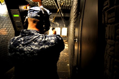 US Navy 101123-N-8335D-123 Fire Controlman 3rd Class William Stratton, assigned to the amphibious dock landing ship USS Tortuga (LSD 46),