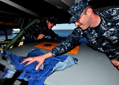 US Navy 101129-N-0569K-006 Interior Communications Electrician 3rd Class Kasey C. Malcom and Interior Communications Electrician Fireman Brandon C