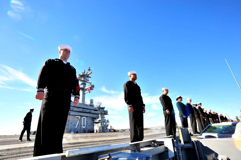 US Navy 101130-N-2953W-126 Sailors man the rails as the aircraft carrier USS Carl Vinson (CVN 70) departs for a three-week composite training unit