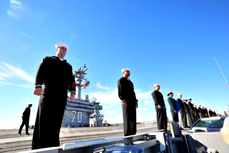 US Navy 101130-N-2953W-126 Sailors man the rails as the aircraft carrier USS Carl Vinson (CVN 70) departs for a three-week composite training unit