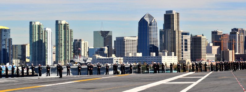 US Navy 101130-N-2953W-175 Sailors man the rails as the aircraft carrier USS Carl Vinson (CVN 70) departs for a three-week composite training unit