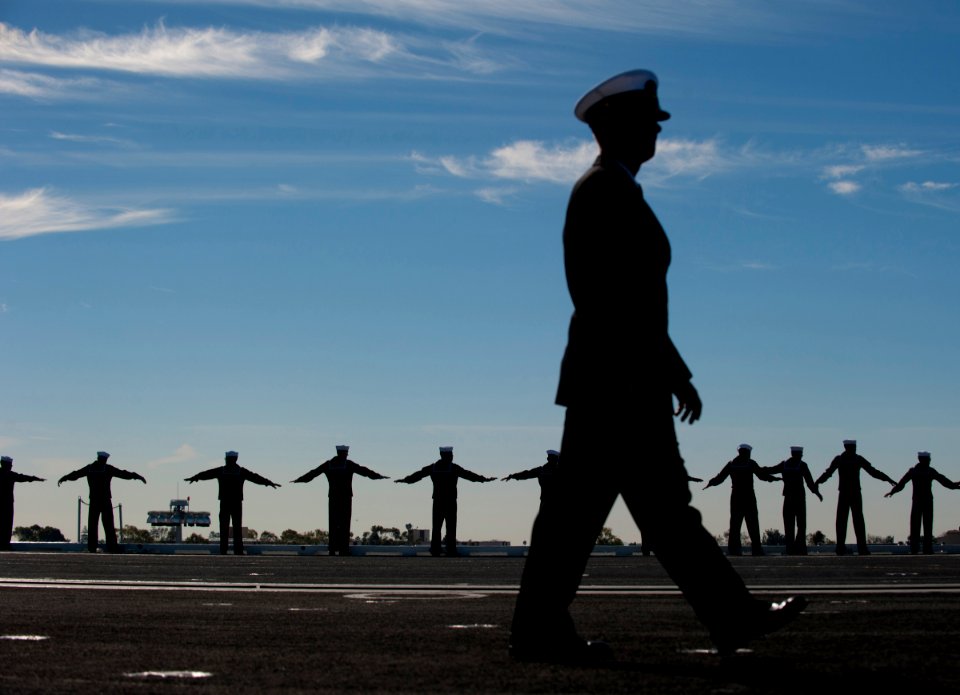 US Navy 101130-N-7981E-564 Sailors form up to man the rails as the aircraft carrier USS Carl Vinson (CVN 70) departs Naval Air Station North Island