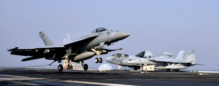 US Navy 101129-N-7103C-020 An F-A-18E Super Hornet assigned to the Eagles of Strike Fighter Squadron (VFA) 115 lands aboard the aircraft carrier US