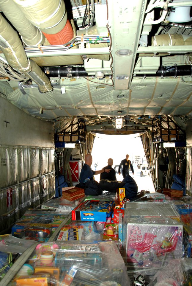 US Navy 101203-N-0092J-148 Sailors and Marines assigned to the U.S. Navy flight demonstration squadron, the Blue Angels, load pallets filled with t