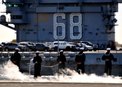 US Navy 101130-N-2055M-109 Sailors man the rails as the aircraft carrier USS Carl Vinson (CVN 70) depart s for a three-week composite training unit