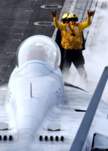 US Navy 101202-N-2055M-299 Aircraft directors guide an F-A-18F Super Hornet assigned to Strike Fighter Squadron (VFA) 22