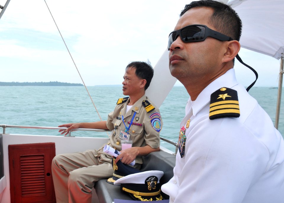 US Navy 101203-N-8721D-059 Cmdr. Michael V. Misiewicz, commanding officer of the guided-missile destroyer USS Mustin (DDG 89) rides a ferry to visi
