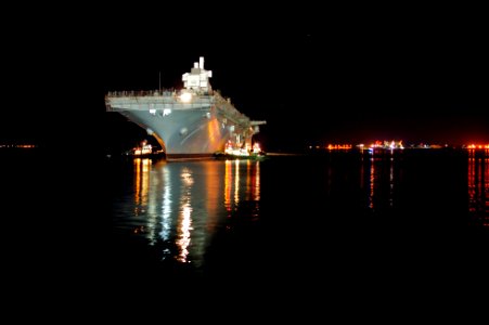 US Navy 101201-N-9643K-821 Tugboats maneuver the amphibious assault ship USS Bonhomme Richard (LHD 6) toward the NASSCO dry-dock