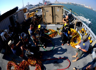 US Navy 101202-N-0413B-103 Navy divers assigned to Mobile Diving and Salvage Unit (MDSU) 2 prepare for a surface-supplied air dive aboard the Milit