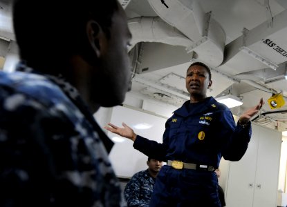 US Navy 101205-N-2055M-333 Command Master Chief April Beldo addresses Sailors during a second class petty officer leadership course aboard the airc