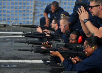 US Navy 101205-N-5838W-001 Sailors assigned to the guided-missile destroyer USS Mason (DDG 87) fire M-16 rifles during a small arms qualification o photo