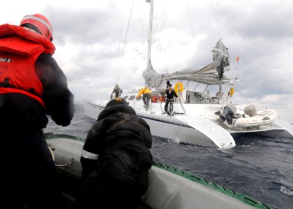 US Navy 101203-N-3885H-155 Sailors assigned to the aircraft carrier USS George H.W. Bush (CVN 77) render aid to a civilian vessel that ran out of f