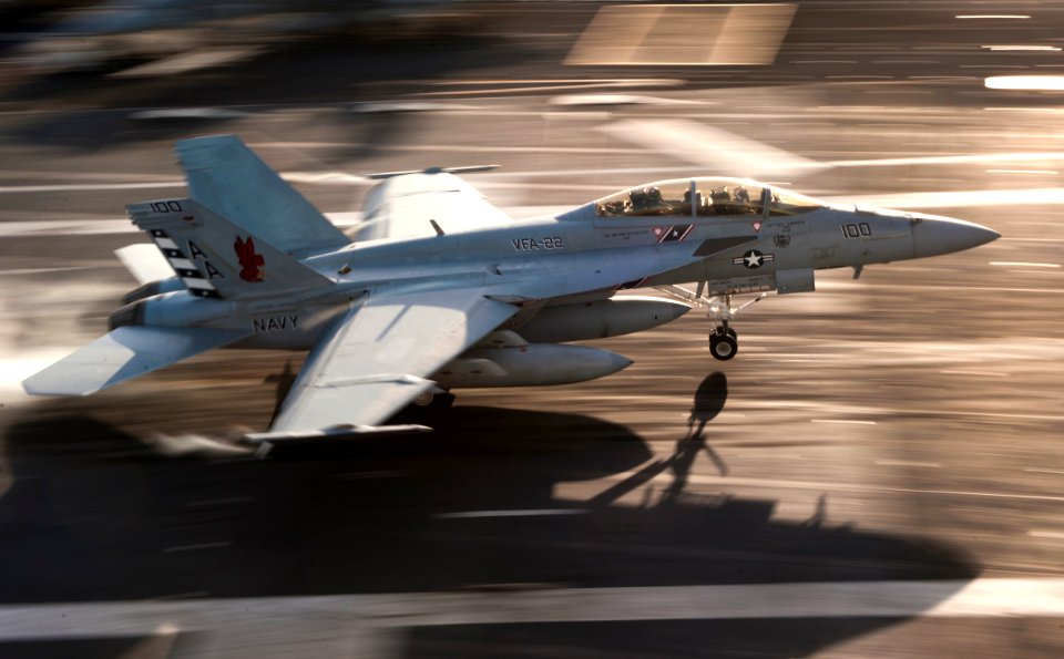 US Navy 101202-N-7981E-439 An F-A-18F Super Hornet assigned to Strike Fighter Squadron (VFA) 22 lands aboard the aircraft carrier USS Carl Vinson (