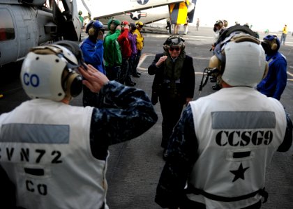 US Navy 101206-N-4973M-048 Secretary of Defense Robert M. Gates is greeted aboard the aircraft carrier USS Abraham Lincoln (CVN 72)